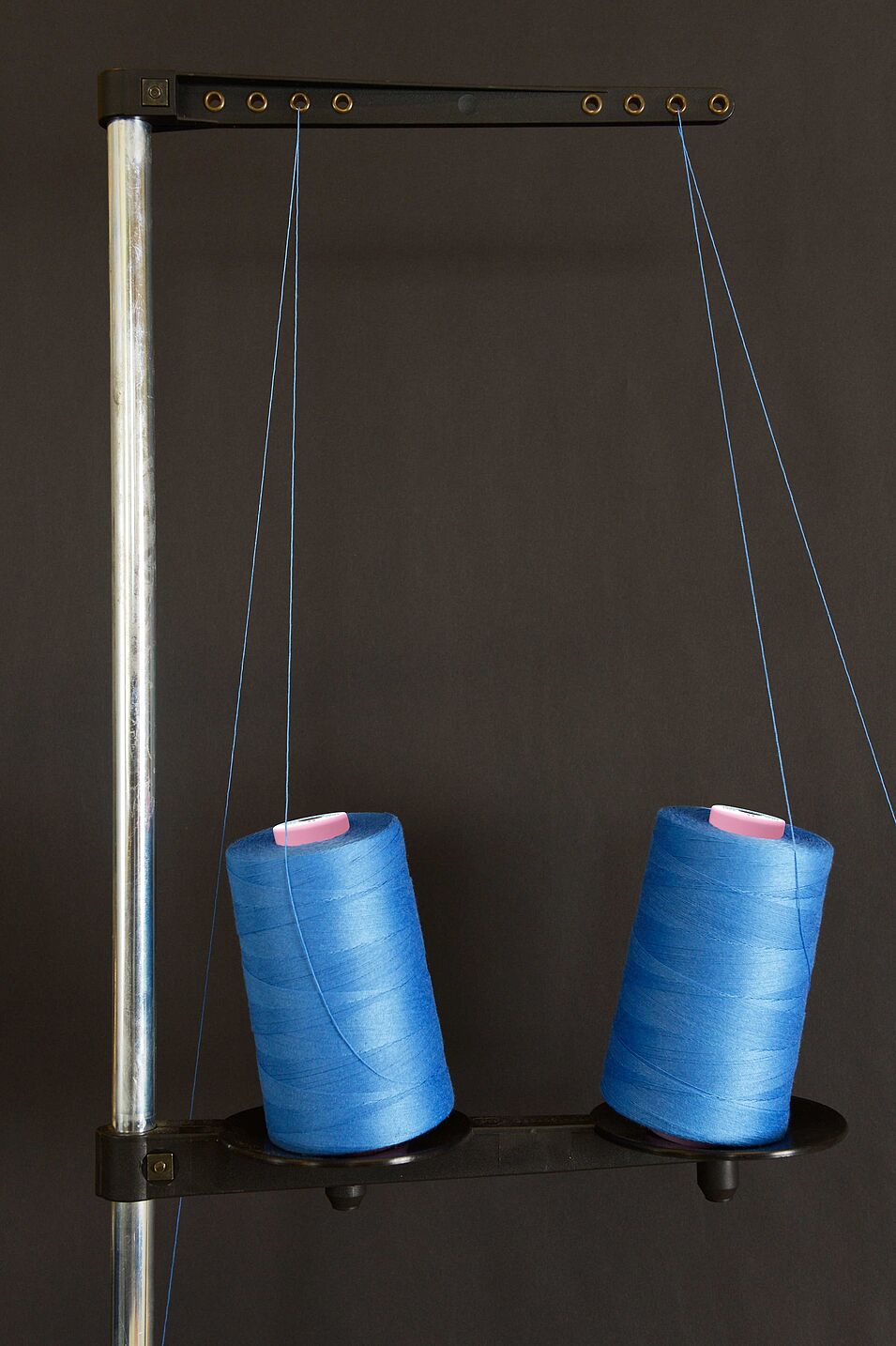 Cones standing at an angle due to missing spool holders (impeded off-winding performance)