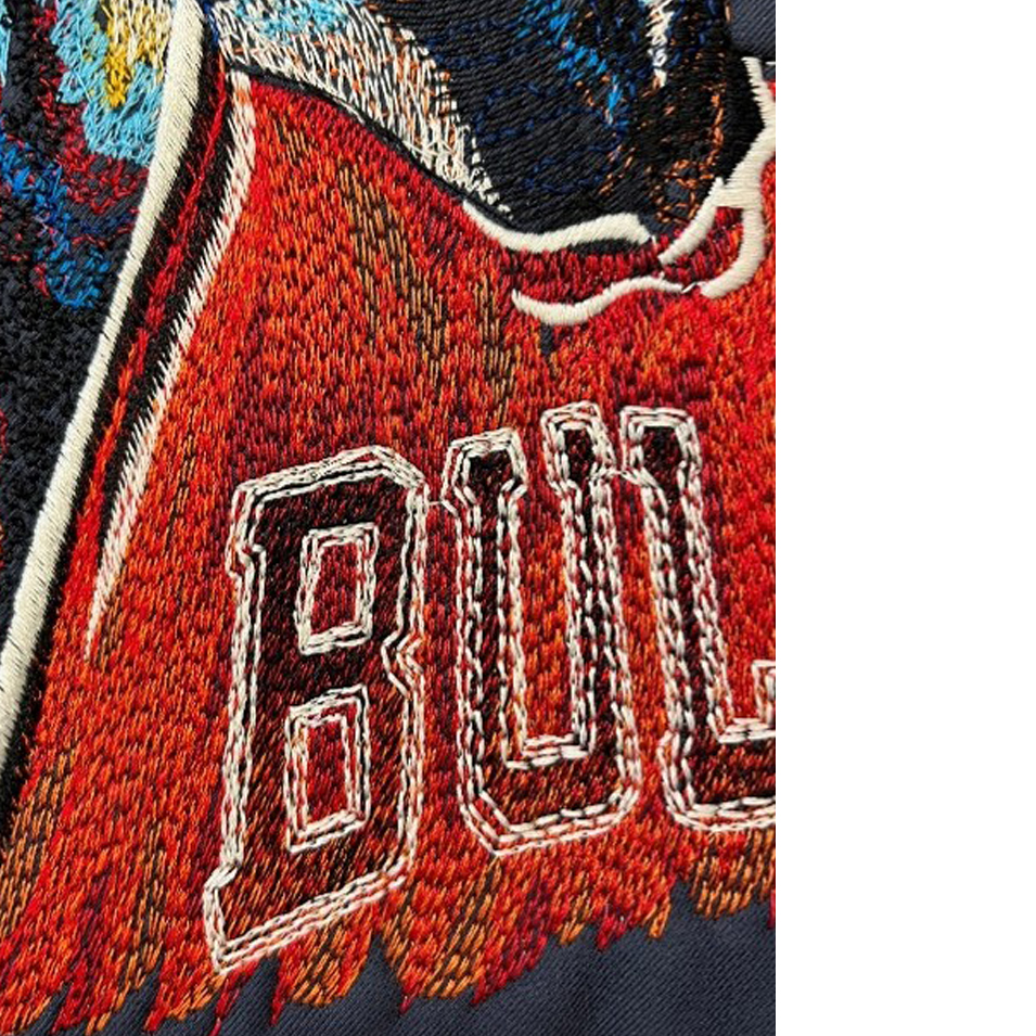 Close-up demonstrating colour blending achieved through open stitch distances and consistent stitch direction