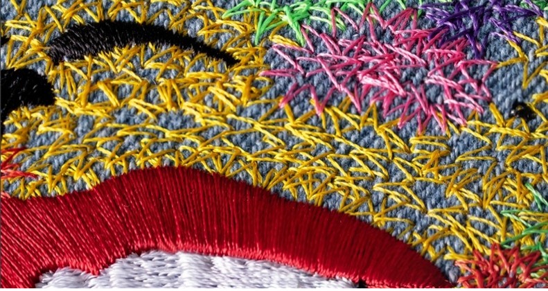 Leaving space between stitches lets the fabric breathe through the portrait.